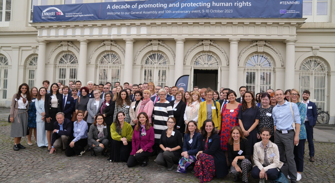ENNHRI members group photo in front of the Museum of Fine Arts in Brussels, taken during ENNHRI's 10th anniversary